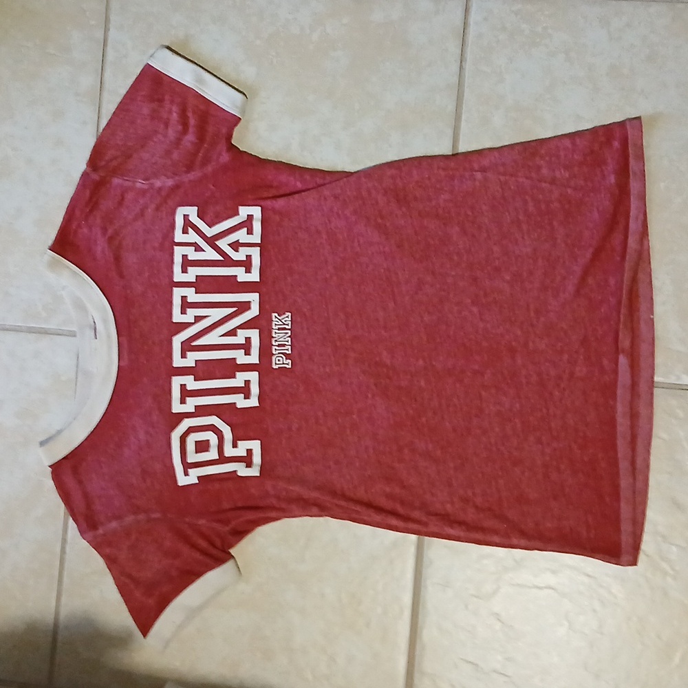 Pink brand t-shirt. Size: xs (but it's a loose fit). Color: pink/red